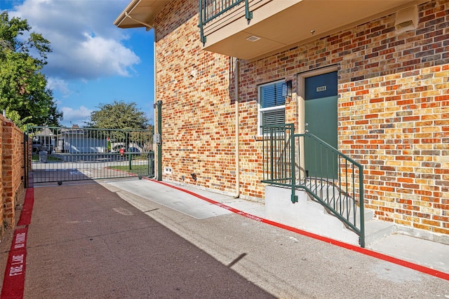 11218 Park Central Pl Unit B, Dallas, TX 75230 - doorway to property with a gate and brick siding