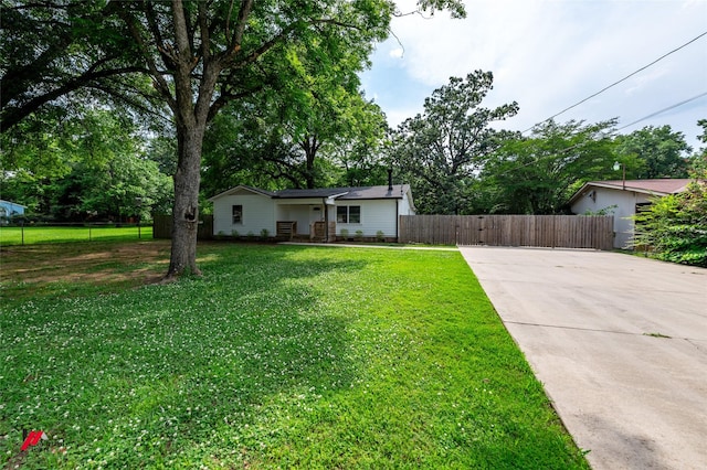 9472 Ranch Ln, Shreveport, LA 71106 - ranch-style house featuring concrete driveway and view of scattered trees