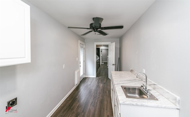 9472 Ranch Ln, Shreveport, LA 71106 - hall with a sink, dark wood finished floors, and baseboards