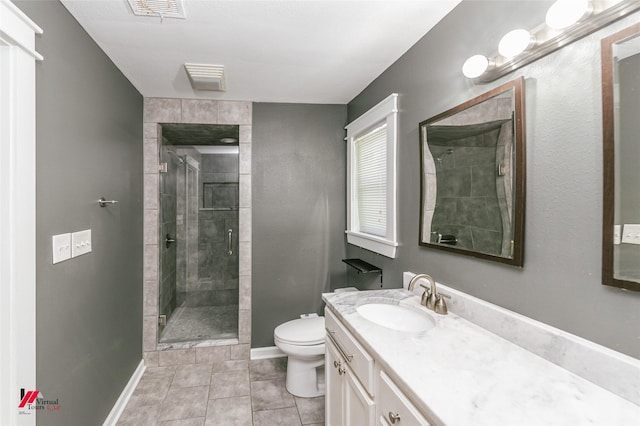 9472 Ranch Ln, Shreveport, LA 71106 - bathroom featuring toilet, vanity, a shower stall, tile patterned flooring, and baseboards