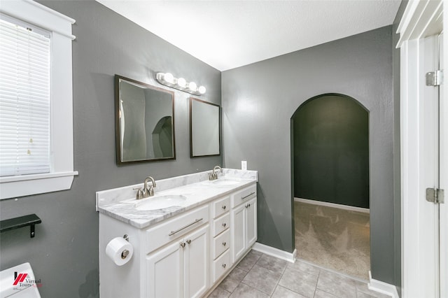 9472 Ranch Ln, Shreveport, LA 71106 - bathroom featuring double vanity, tile patterned floors, and baseboards