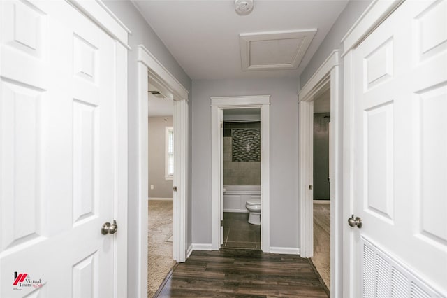 9472 Ranch Ln, Shreveport, LA 71106 - hallway featuring dark carpet, baseboards, and dark wood-style flooring