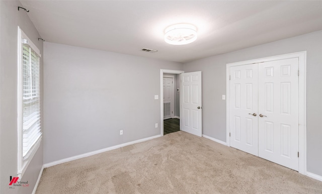 9472 Ranch Ln, Shreveport, LA 71106 - unfurnished bedroom featuring carpet, baseboards, and a closet