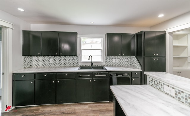 9472 Ranch Ln, Shreveport, LA 71106 - kitchen with a sink, dark cabinetry, wood finished floors, tasteful backsplash, and recessed lighting