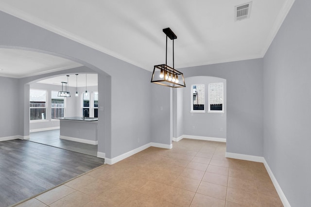 211 Debbie Way, Red Oak, TX 75154 - empty room with light tile patterned floors, ornamental molding, arched walkways, and baseboards