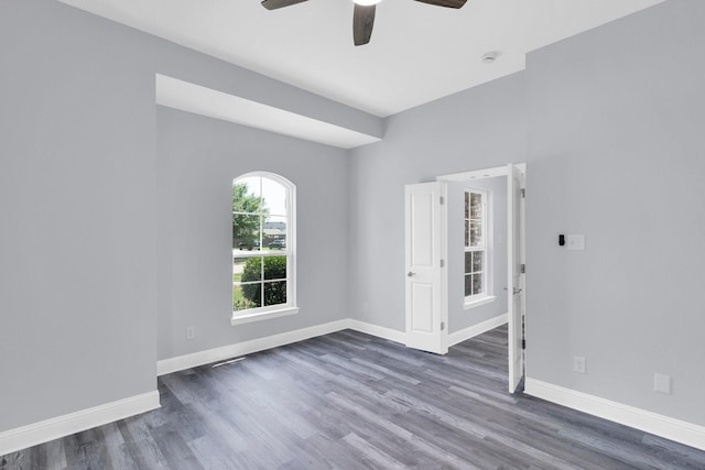 211 Debbie Way, Red Oak, TX 75154 - unfurnished room featuring wood finished floors, a ceiling fan, and baseboards
