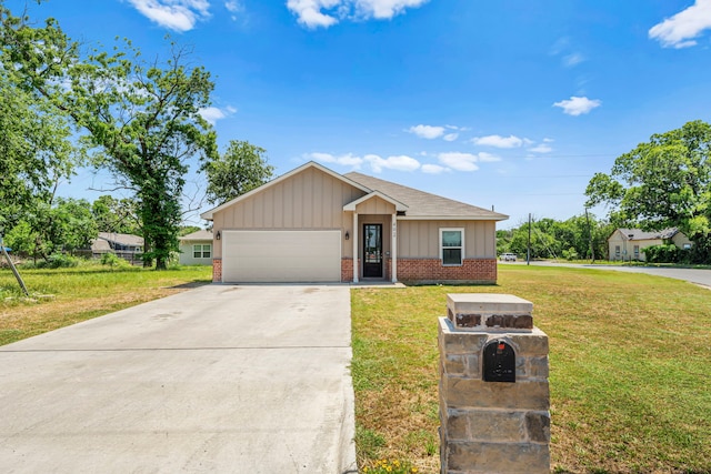 402 Robbins St, Cleburne, TX 76031 - single story home featuring brick siding, board and batten siding, an attached garage, concrete driveway, and a front lawn