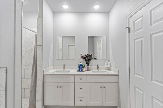 402 Robbins St, Cleburne, TX 76031 - full bath featuring double vanity and a marble finish shower