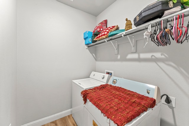 402 Robbins St, Cleburne, TX 76031 - washroom featuring washer and dryer, light wood finished floors, and baseboards