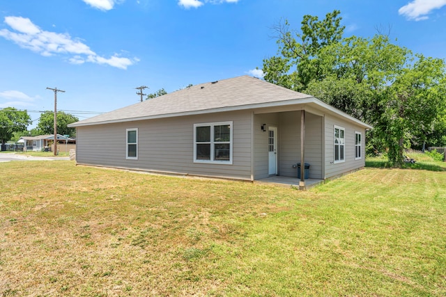 402 Robbins St, Cleburne, TX 76031 - rear view of house with a yard