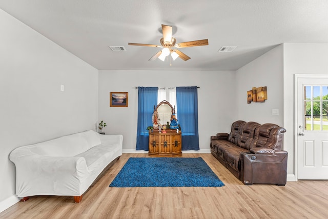 402 Robbins St, Cleburne, TX 76031 - living area featuring wood finished floors, a ceiling fan, and baseboards
