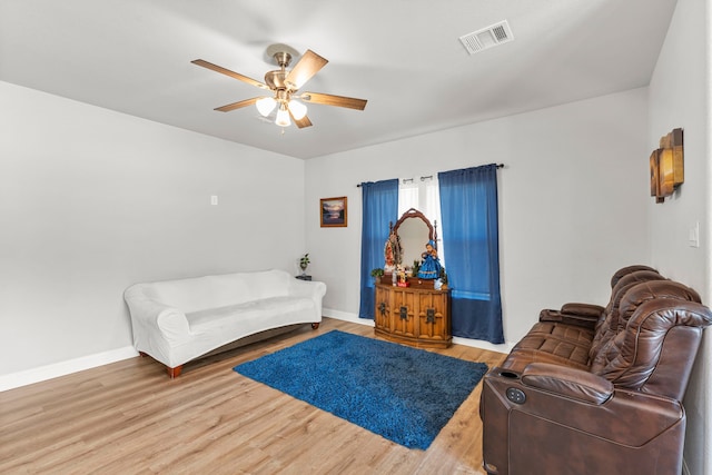 402 Robbins St, Cleburne, TX 76031 - living room with ceiling fan, baseboards, and wood finished floors
