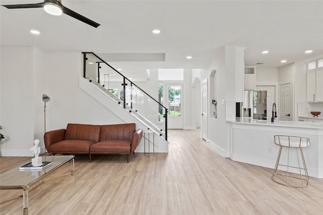 3717 Estacado Ln, Plano, TX 75025 - living room with light wood-style floors, ceiling fan, baseboards, stairway, and recessed lighting