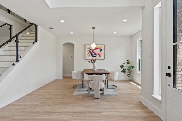 3717 Estacado Ln, Plano, TX 75025 - dining room featuring baseboards, recessed lighting, stairway, arched walkways, and light wood-style floors