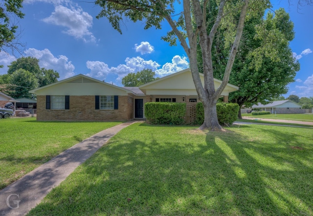 3422 Lanell Dr, Bossier City, LA 71112 - view of front facade with brick siding and a front yard