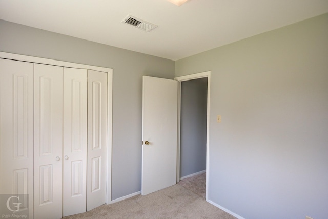 3422 Lanell Dr, Bossier City, LA 71112 - unfurnished bedroom with light colored carpet, a closet, and baseboards
