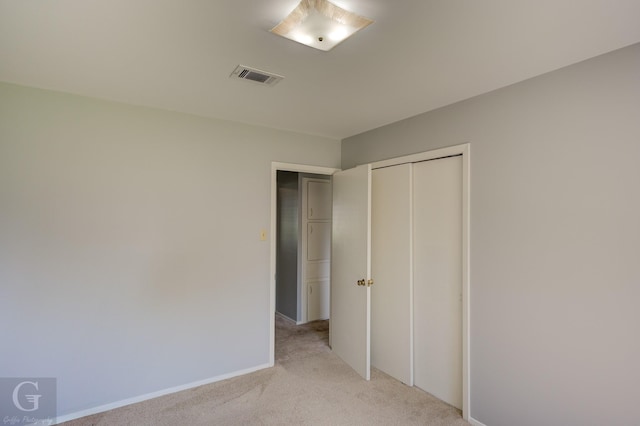 3422 Lanell Dr, Bossier City, LA 71112 - unfurnished bedroom with light colored carpet, a closet, and baseboards