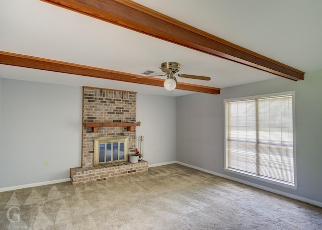 3422 Lanell Dr, Bossier City, LA 71112 - unfurnished living room featuring beam ceiling, carpet flooring, a ceiling fan, a brick fireplace, and baseboards