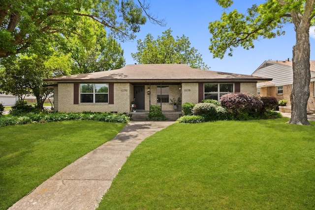 11138 Wyatt St, Dallas, TX 75218 - ranch-style home with brick siding, a front yard, and a porch