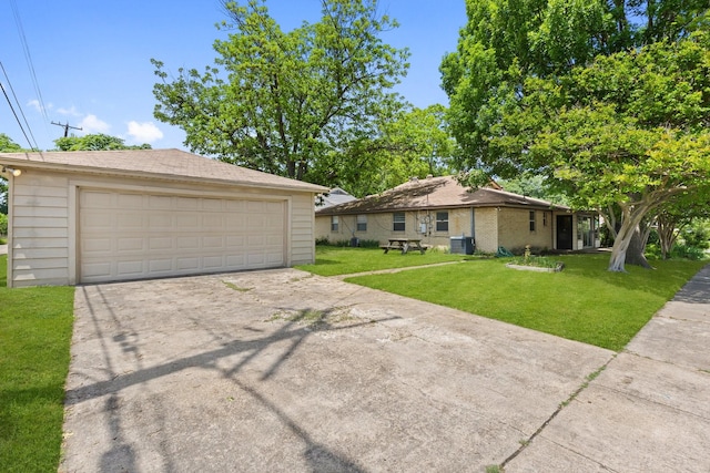 11138 Wyatt St, Dallas, TX 75218 - view of front of home featuring an outdoor structure, a front yard, a garage, and central AC