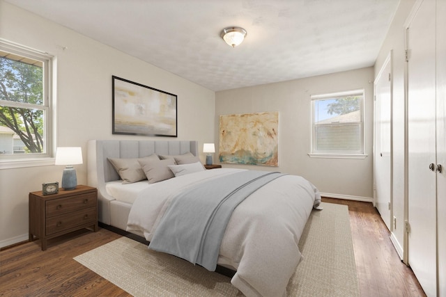 11138 Wyatt St, Dallas, TX 75218 - bedroom featuring wood finished floors and baseboards
