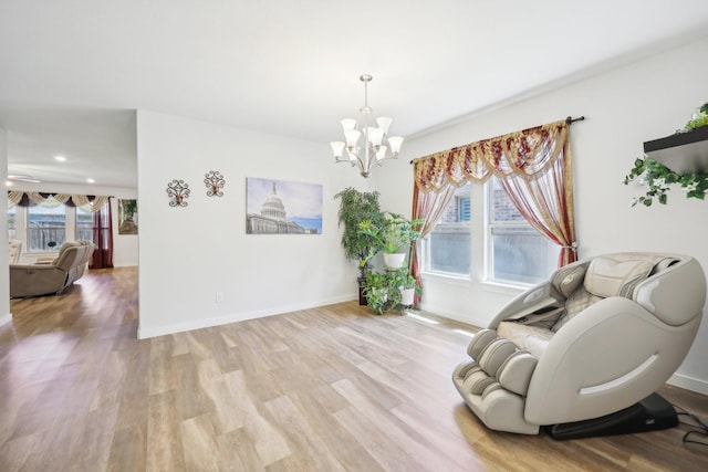 1816 Dunstan Dr, Fort Worth, TX 76052 - living area featuring light wood-style flooring, a chandelier, and baseboards