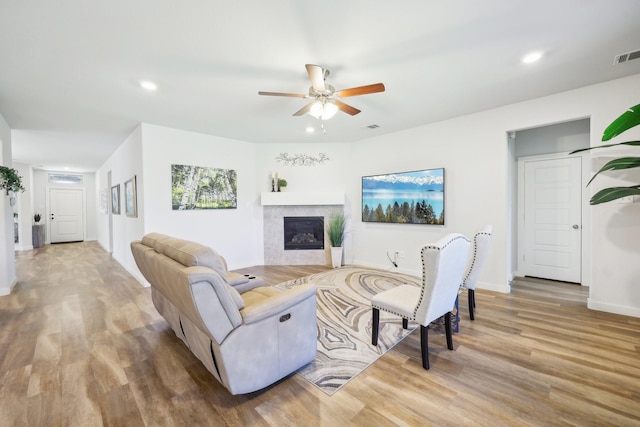 1816 Dunstan Dr, Fort Worth, TX 76052 - living room with ceiling fan, wood finished floors, recessed lighting, a glass covered fireplace, and baseboards