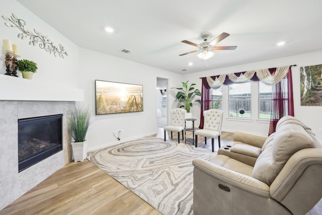 1816 Dunstan Dr, Fort Worth, TX 76052 - living area featuring wood finished floors, a ceiling fan, recessed lighting, a fireplace, and baseboards