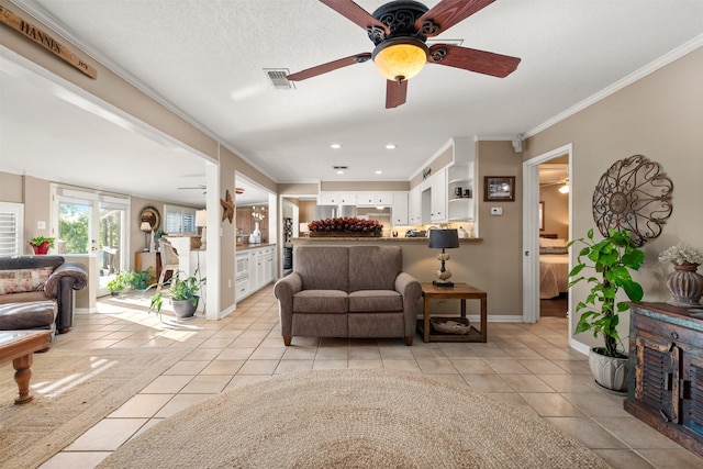 311 County Road 1710, Clifton, TX 76634 - living room with a ceiling fan, light tile patterned floors, crown molding, baseboards, and recessed lighting