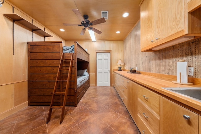 311 County Road 1710, Clifton, TX 76634 - kitchen with dark tile patterned flooring, recessed lighting, butcher block countertops, a ceiling fan, and light brown cabinets