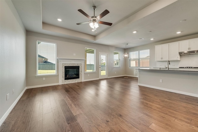 6314 Catalpa Dr, Venus, TX 76084 - unfurnished living room featuring a sink, plenty of natural light, dark wood-type flooring, a ceiling fan, and recessed lighting