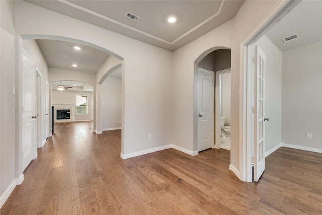 6314 Catalpa Dr, Venus, TX 76084 - hallway with wood finished floors, baseboards, arched walkways, and recessed lighting