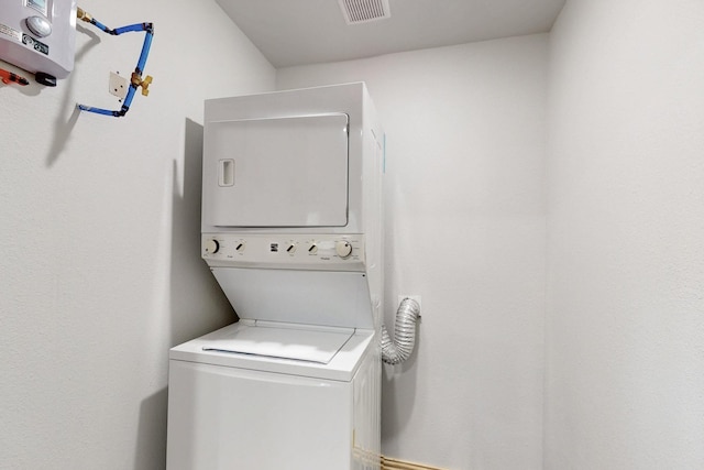 6725 Lovett Ave, Dallas, TX 75227 - laundry area featuring stacked washing machine and dryer