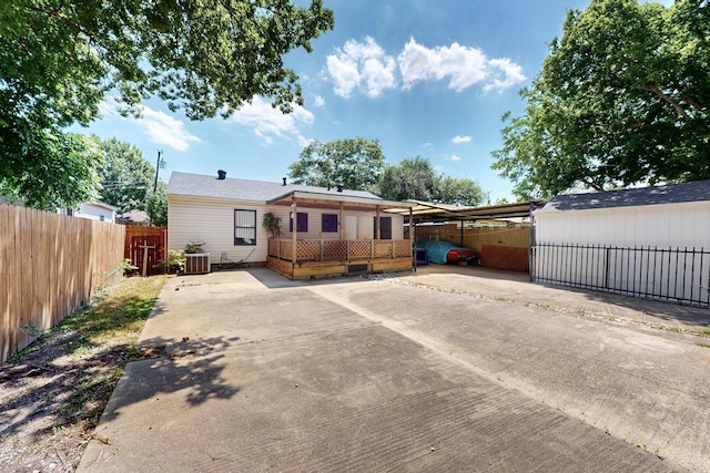 6725 Lovett Ave, Dallas, TX 75227 - view of front of home featuring driveway, an attached carport, and central AC unit