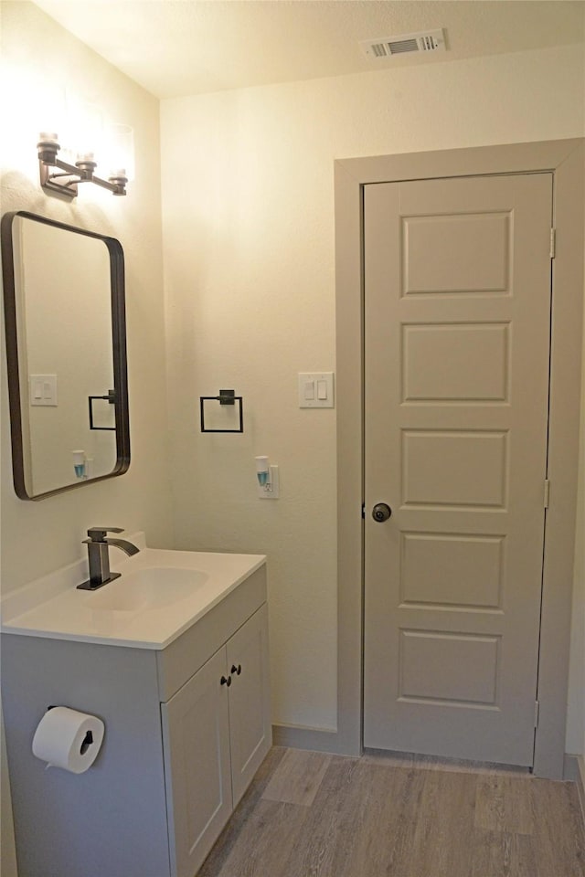 7810 Larchridge Dr, Dallas, TX 75232 - bathroom featuring vanity and wood finished floors