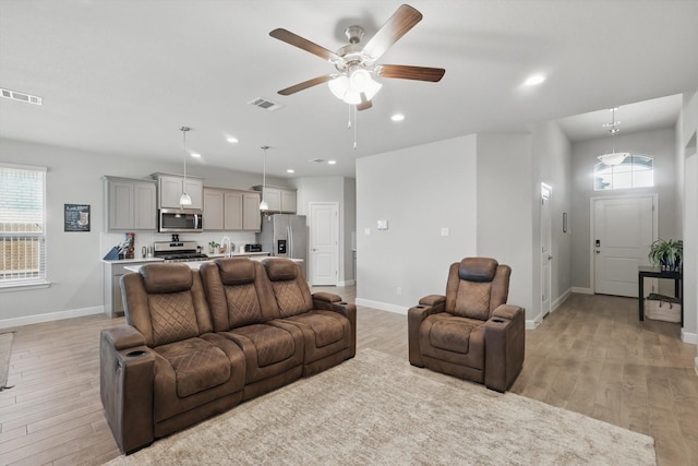 120 Texasage St, Rhome, TX 76078 - living area featuring light wood-style flooring, a ceiling fan, baseboards, and recessed lighting