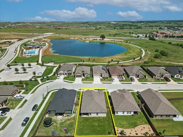 120 Texasage St, Rhome, TX 76078 - aerial perspective of suburban area with a nearby body of water and property parcel outlined
