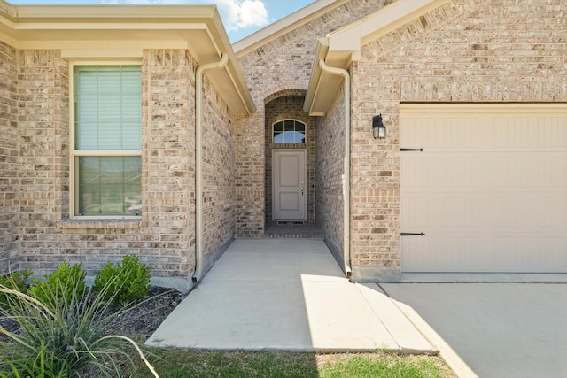 120 Texasage St, Rhome, TX 76078 - property entrance with a garage and brick siding