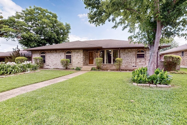 1308 Warwick St, Garland, TX 75040 - single story home with brick siding, a front yard, a chimney, and a shingled roof