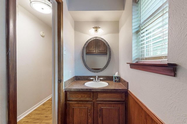 1308 Warwick St, Garland, TX 75040 - bathroom featuring vanity and wood finished floors