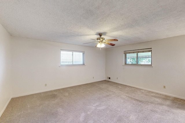 1308 Warwick St, Garland, TX 75040 - empty room with carpet, ceiling fan, baseboards, and a textured ceiling