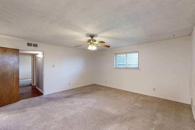 1308 Warwick St, Garland, TX 75040 - empty room with carpet flooring, a ceiling fan, a textured ceiling, and baseboards