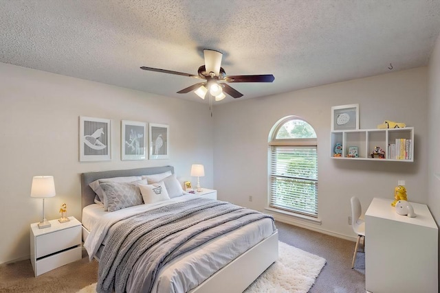 1308 Warwick St, Garland, TX 75040 - bedroom featuring light carpet, a textured ceiling, a ceiling fan, and baseboards