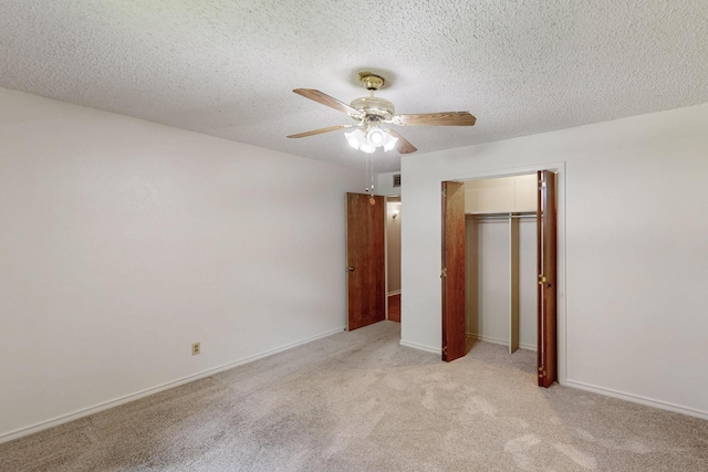 1308 Warwick St, Garland, TX 75040 - unfurnished bedroom featuring a closet, light colored carpet, a ceiling fan, baseboards, and a textured ceiling