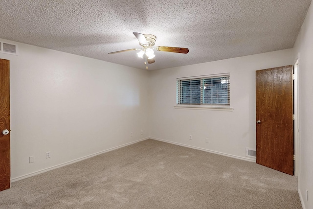 1308 Warwick St, Garland, TX 75040 - empty room featuring a ceiling fan, carpet floors, a textured ceiling, and baseboards