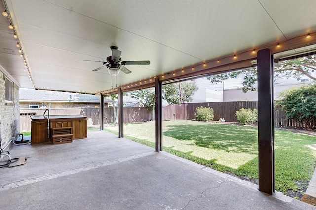 1308 Warwick St, Garland, TX 75040 - view of patio / terrace featuring a hot tub and a ceiling fan