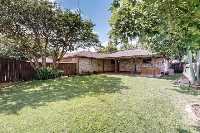 1308 Warwick St, Garland, TX 75040 - view of yard with central AC unit and a hot tub