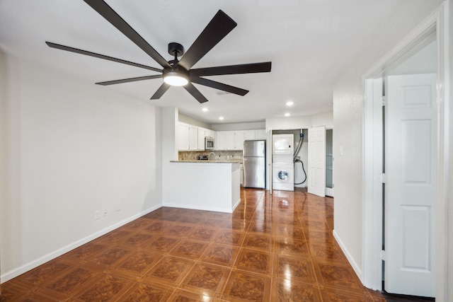 6108 Abrams Rd Unit 601, Dallas, TX 75231 - unfurnished living room with a ceiling fan, recessed lighting, baseboards, and stacked washing machine and dryer
