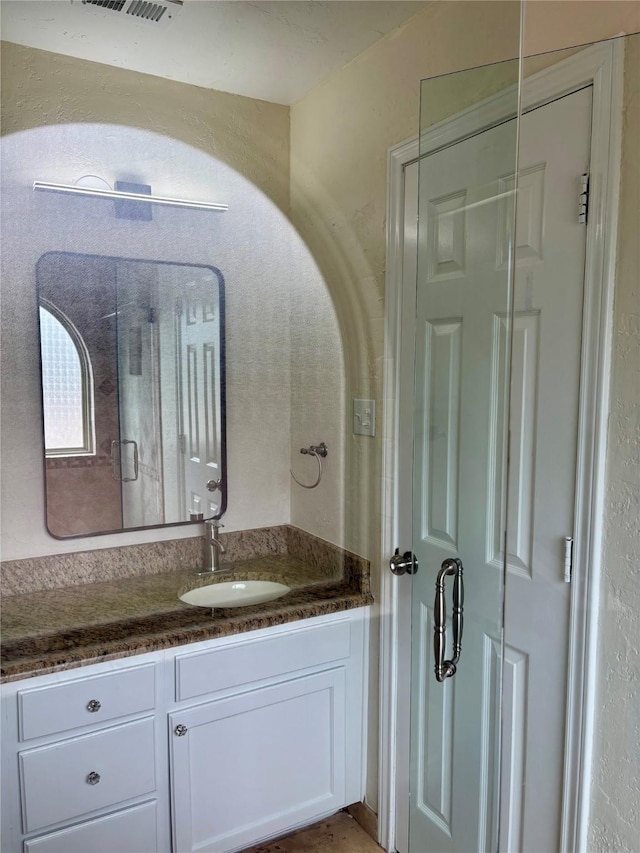 6108 Abrams Rd Unit 601, Dallas, TX 75231 - bathroom with vanity and a shower stall