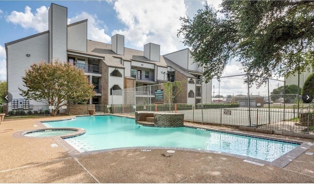 6108 Abrams Rd Unit 601, Dallas, TX 75231 - view of swimming pool with a pool with connected hot tub